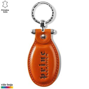 Narandžasti kožni privezak sa utisnutim logotipom Princ Leather i metalnim prstenom za ključeve.