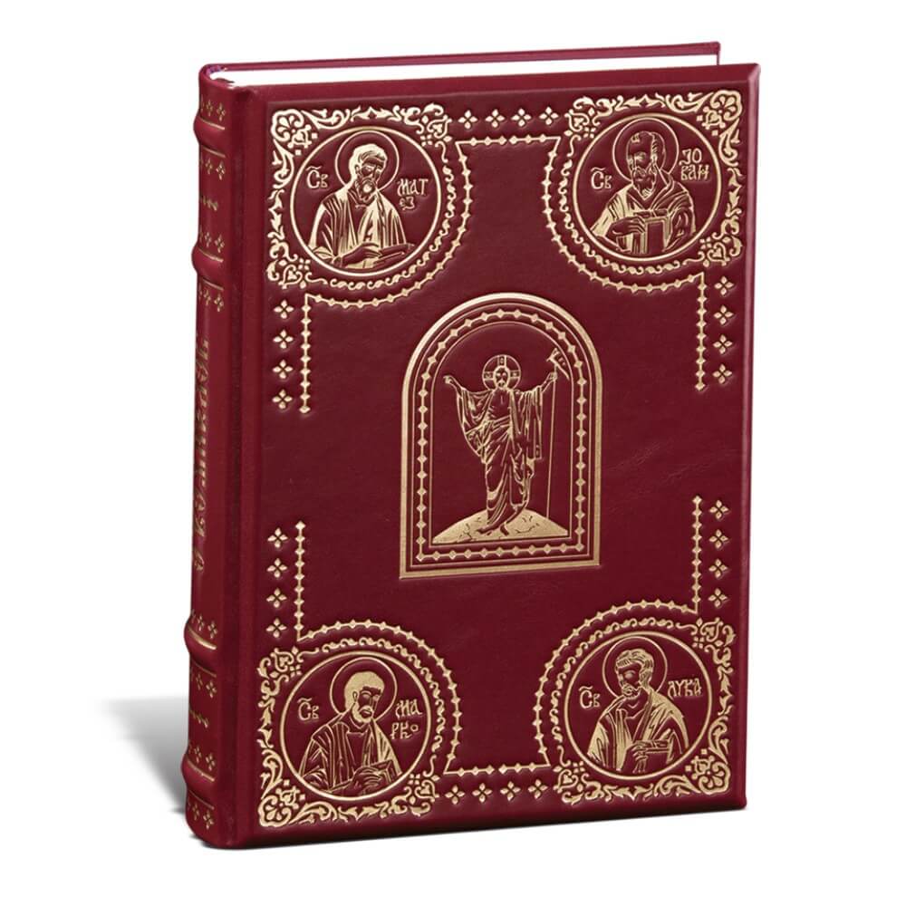 jevandjelje Džepna Biblija sa crvenom kožnom koricom ukrašena zlatnim motivima svetaca i centralnom figurom Isusa u sredini